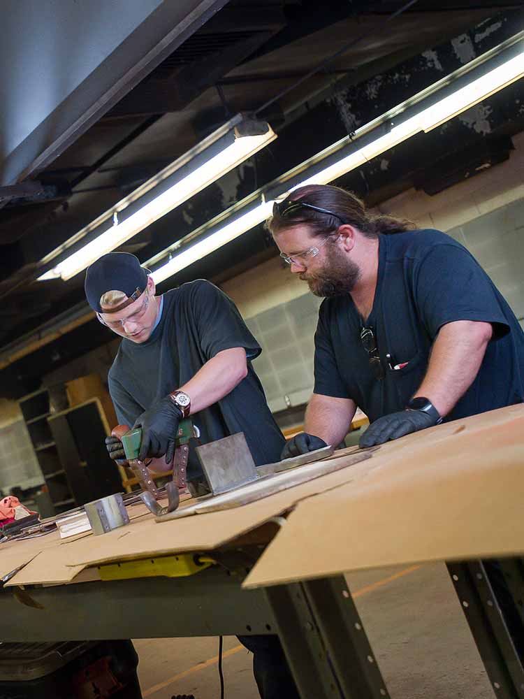 Students working with their hands.