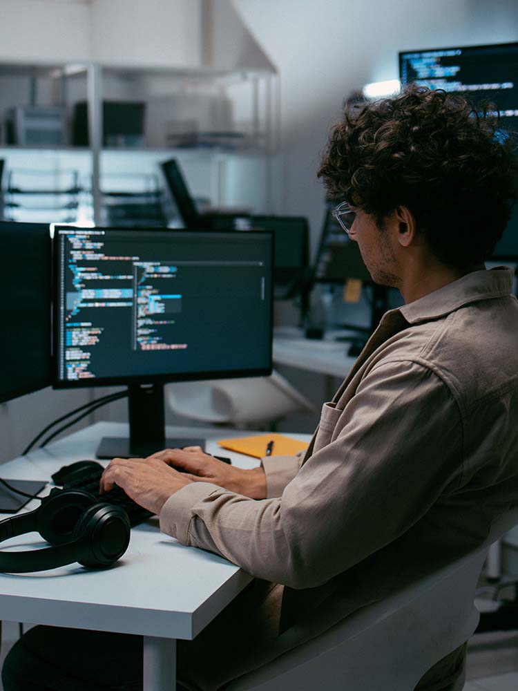 Man working on computer code.