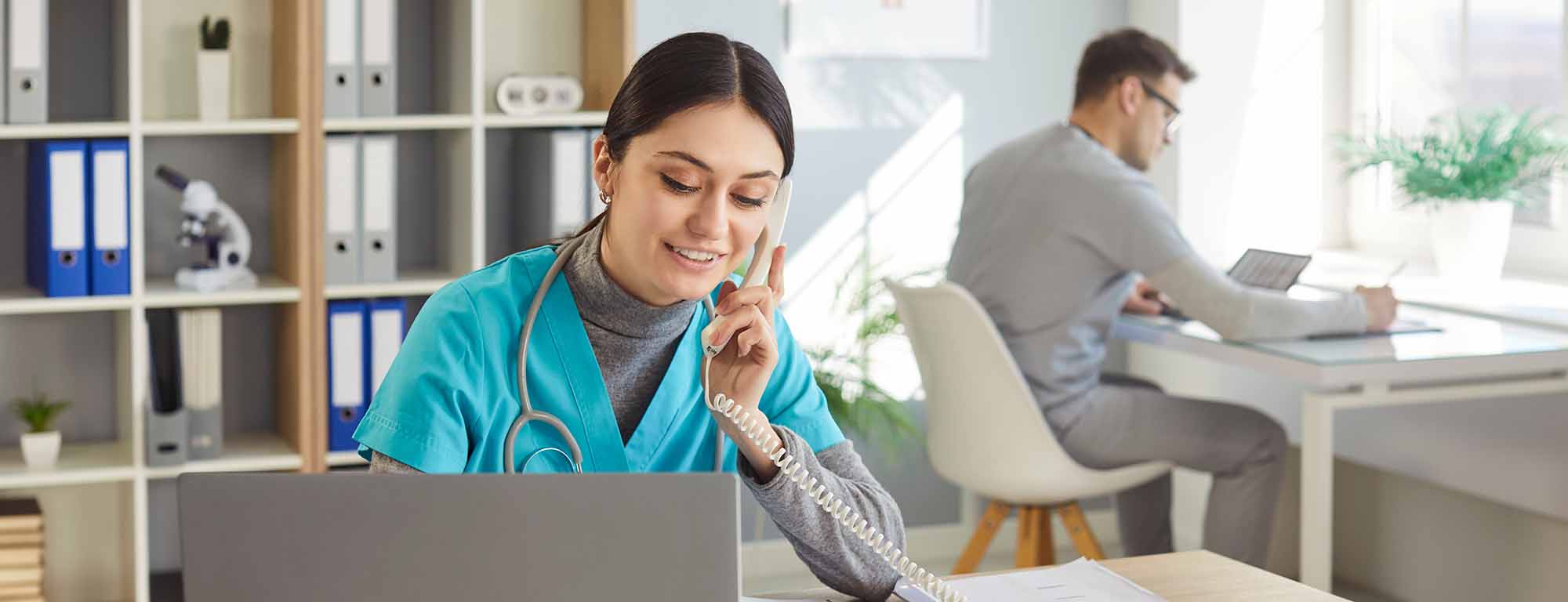 Long Term Care Administrator on phone in office