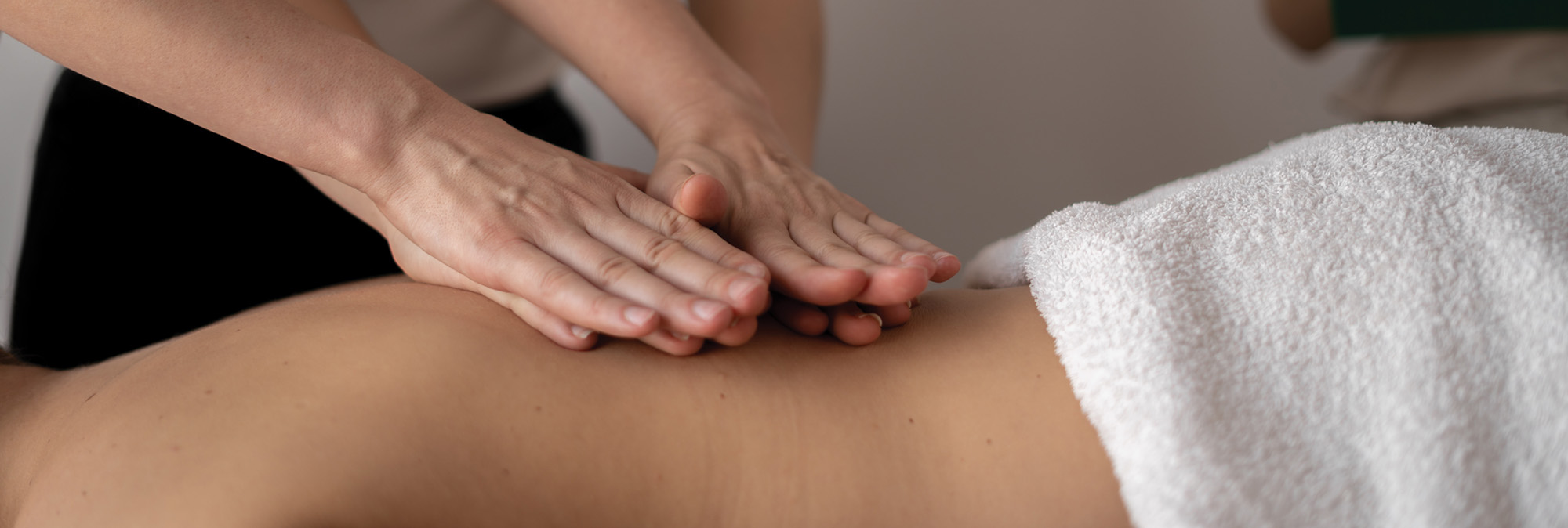 Massage Therapist working on client