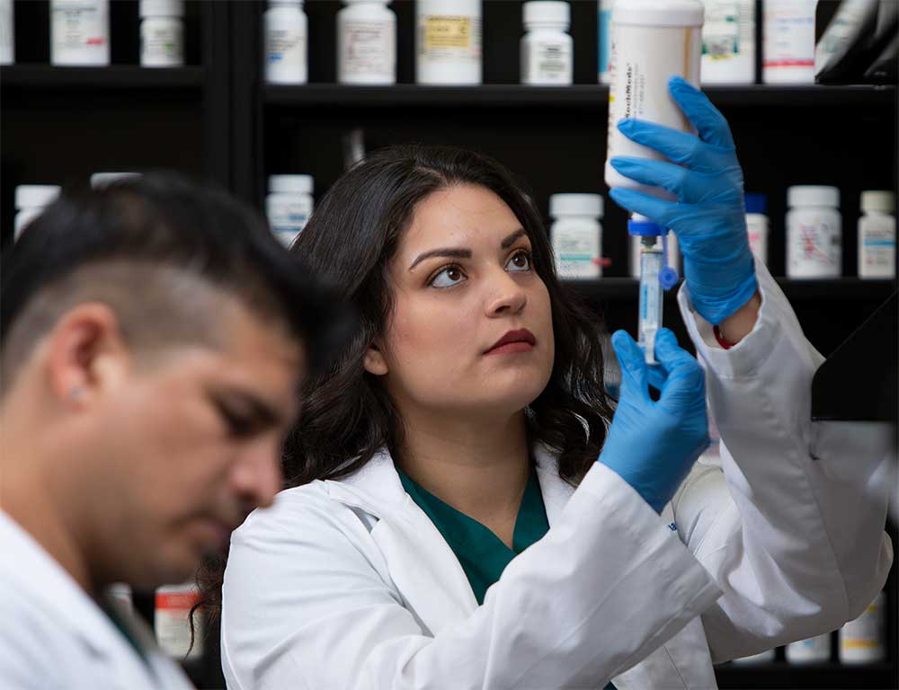 Pharmacy Technician student with syringe