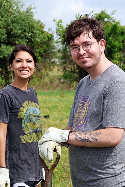 Two San Jacinto College students working at Armand Bayou Nature Center Planting Day