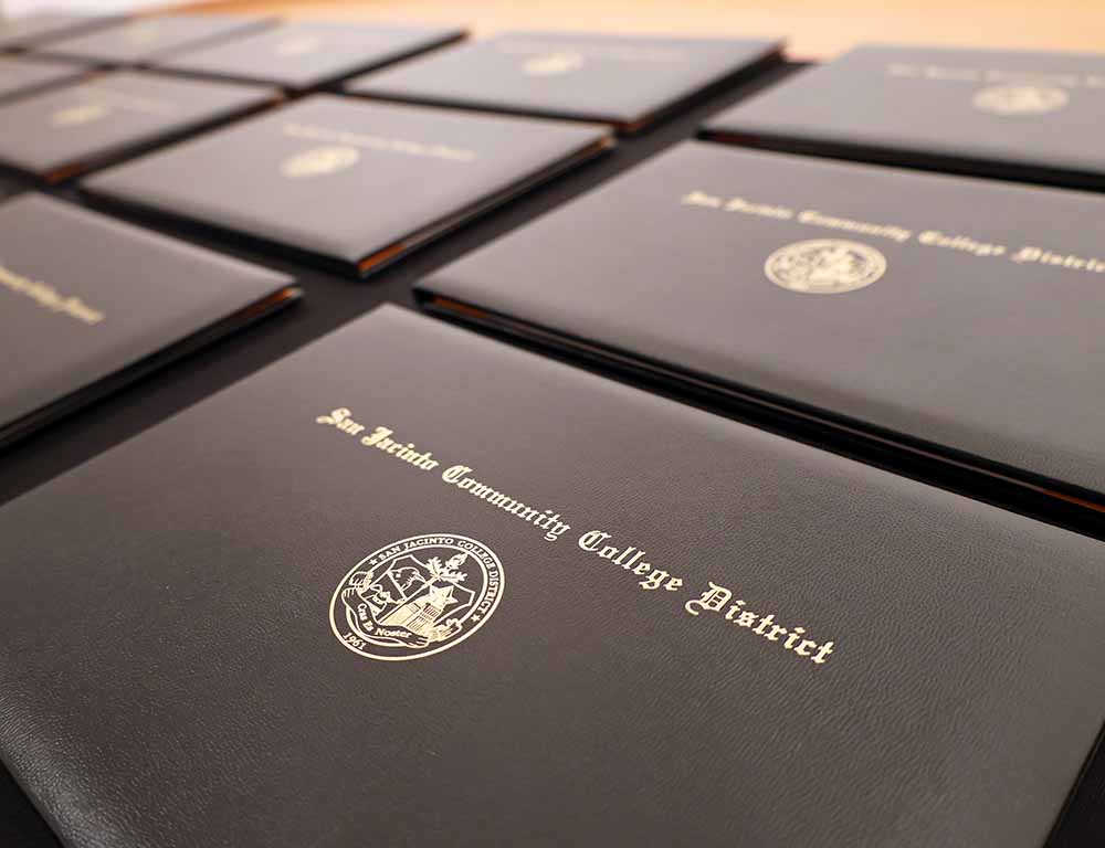 Stacks of San Jacinto College diplomas