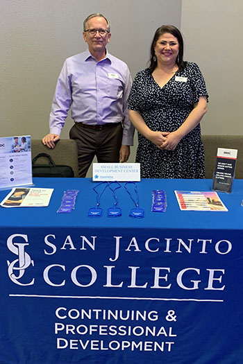 Tabitha Godinez working at a San Jac event booth